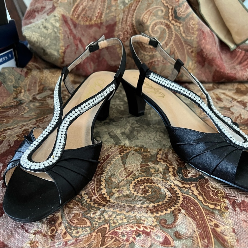 Black satin like material with rhinestones size 9 1/2 wide with 2 1/2” heel…